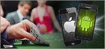 Zwei Smartphones mit Android und Apple Logo. Im Hintergrund ein Casino Tisch.