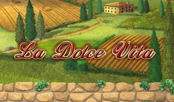 Der Schriftzug 'La Dolce Vita' vor einer malerischen Landschaft.